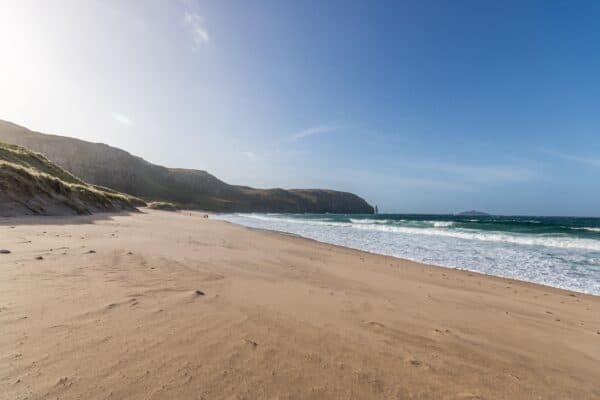Sandwood Bay with blue skies in a VW California Ocean with four seasons campers