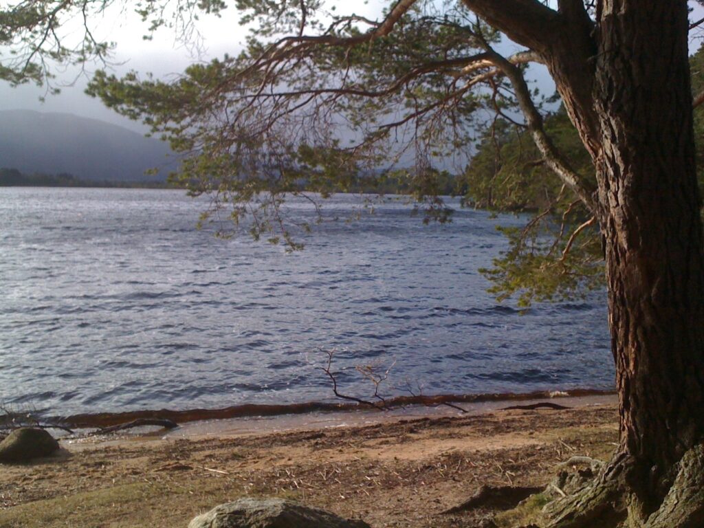 Loch an Eilein with blue sky while renting with Four Seasons Campers