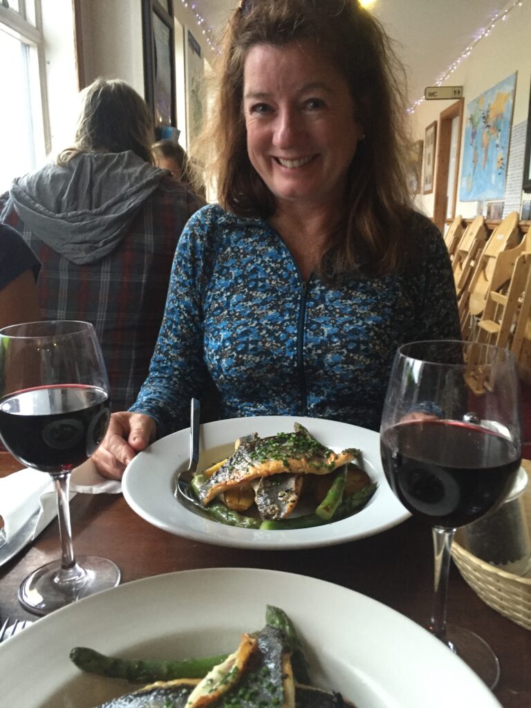 fish seafood with woman at the Edinbane Inn on Four Seasons Campers Road trip Scotland
