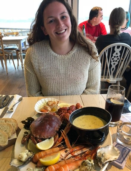 Lady enjoying fresh seafood at Kylesku Hotel, Sutherland