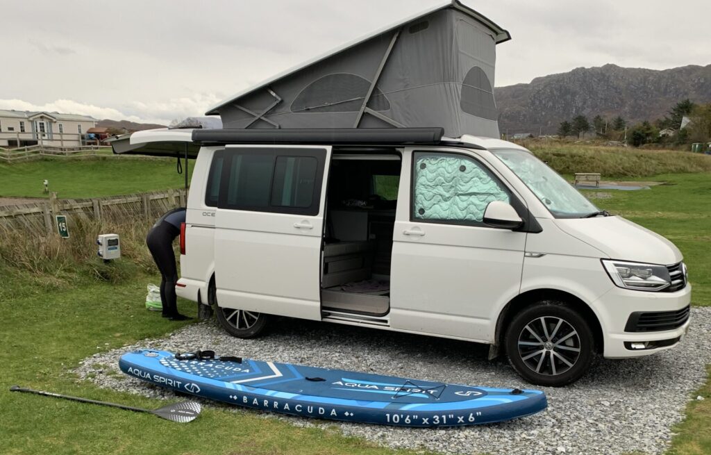 paddleboard with campervan with pop up roof with Four Seasons Campers