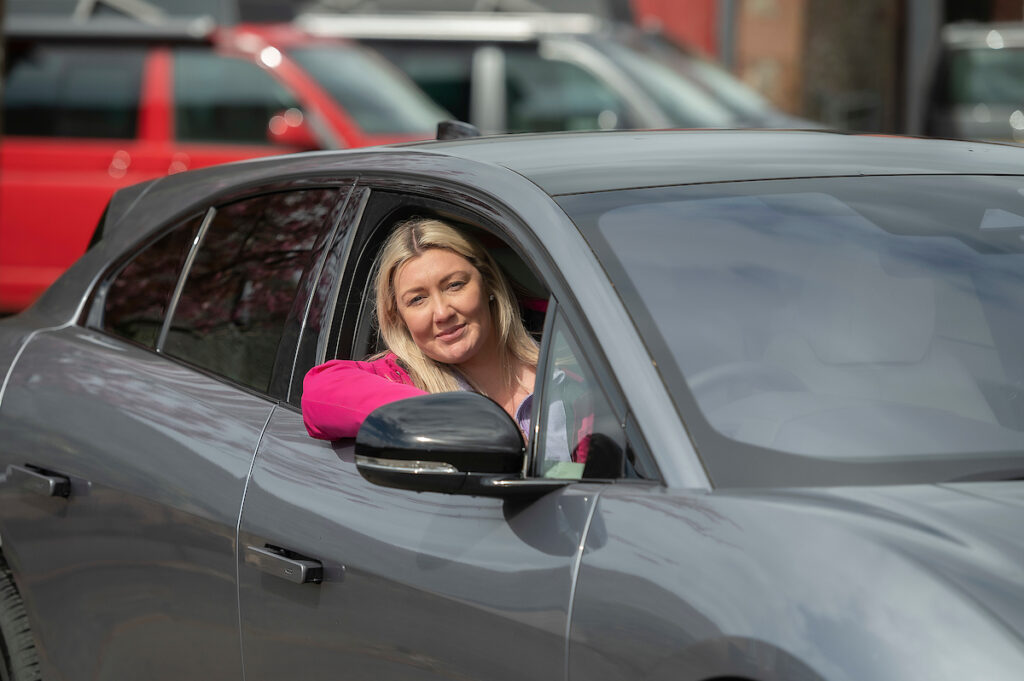 Girl in ipace transfer car for campervan hire Edinburgh and Glasgow