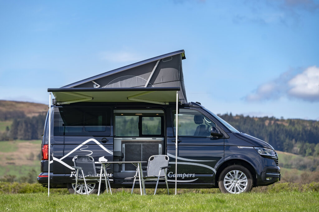 campervan with outdoor furniture and awning