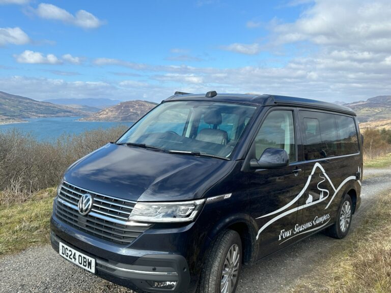 Four Seasons Campervan on a campervan road trip around Scotland overlooking water and islands