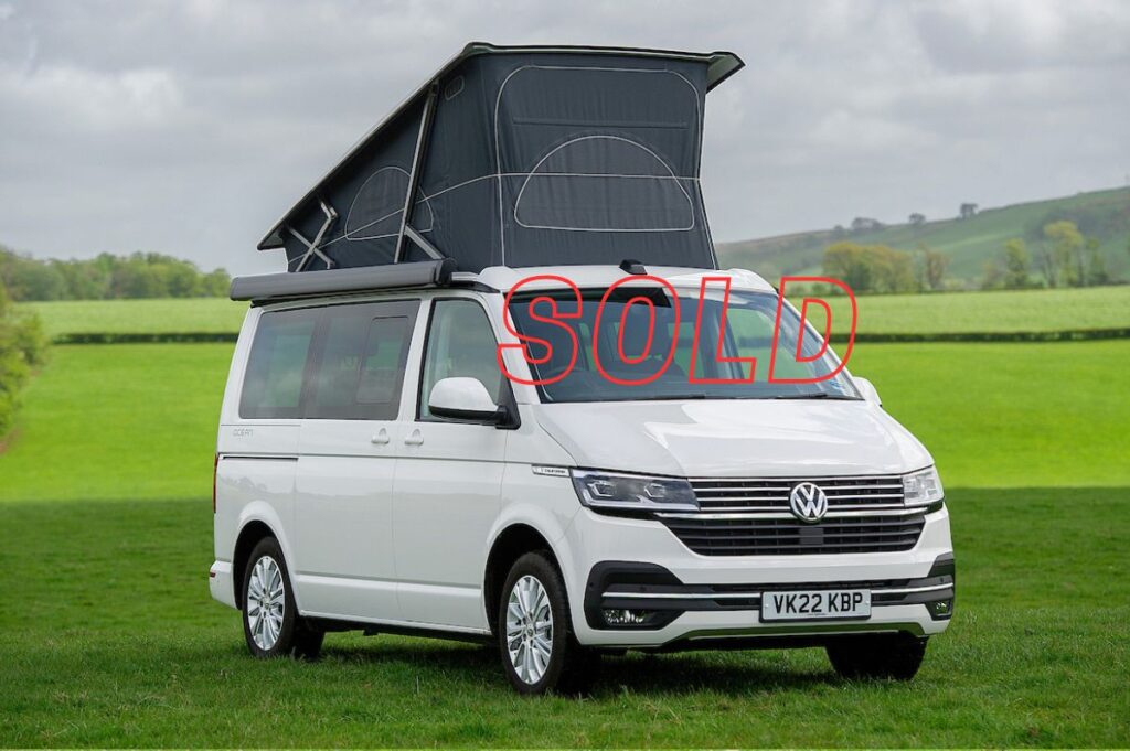 VW Campervan for Sale with pop up roof in white in field at Four Seasons Campers campervan hire Scotland