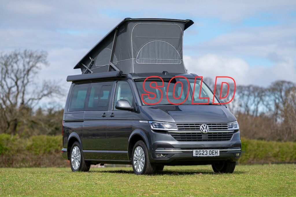 VW Campervan for Sale with pop up roof in indium grey in field at Four Seasons Campers campervan hire Scotland