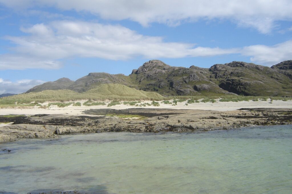 sanna bay ardnmurchan beach west of scotland with sand and sea and blue sky