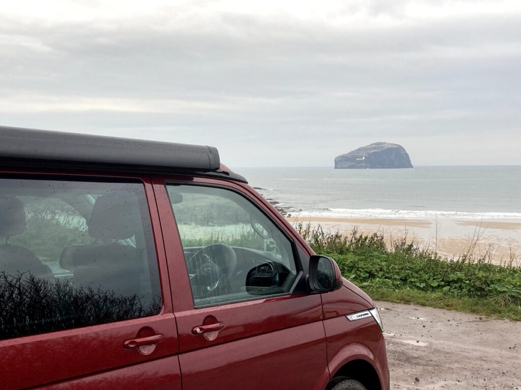 red campervan and bass rock near edinburgh with Seacliff beach